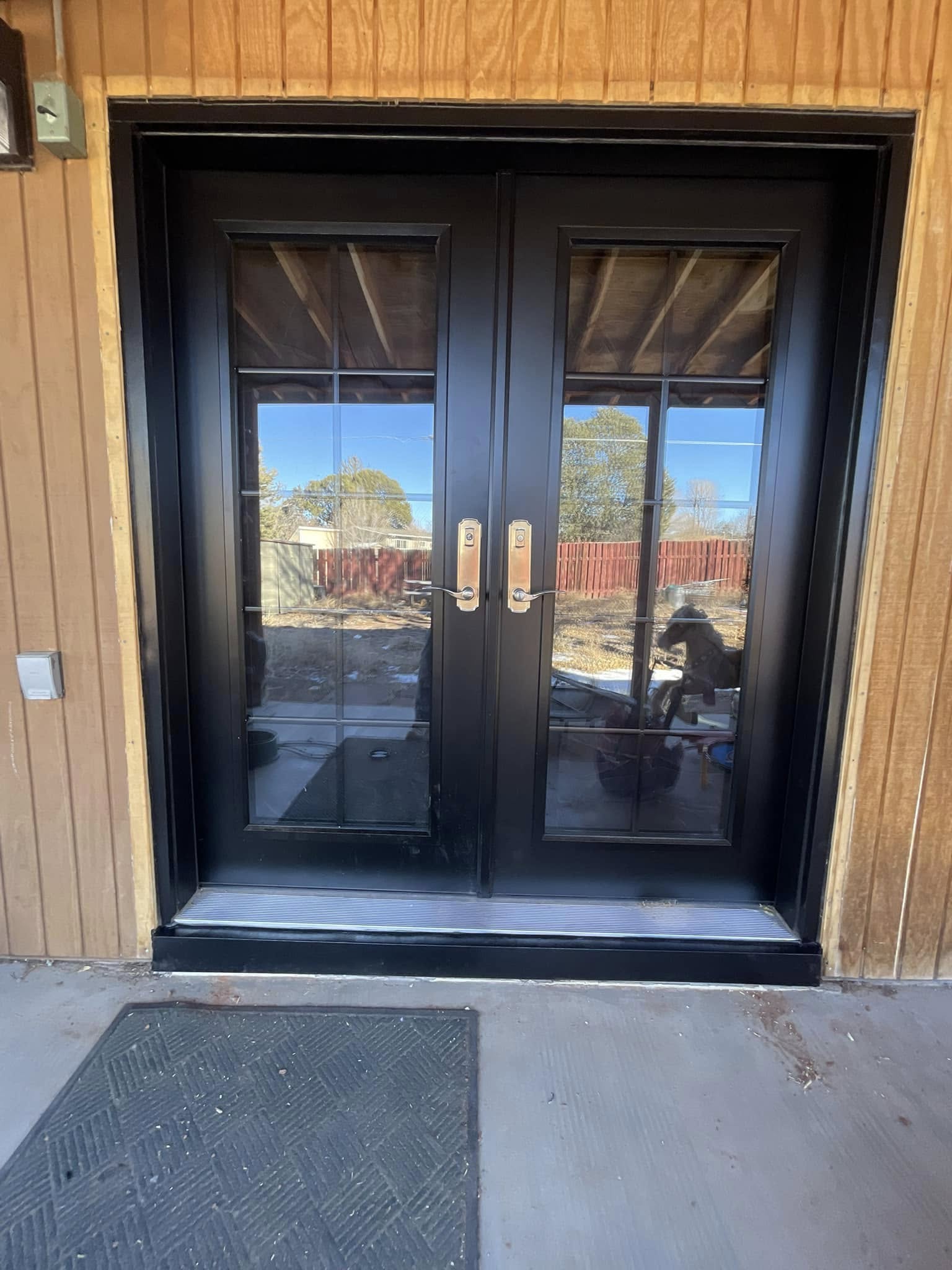 Black French doors with secure locks